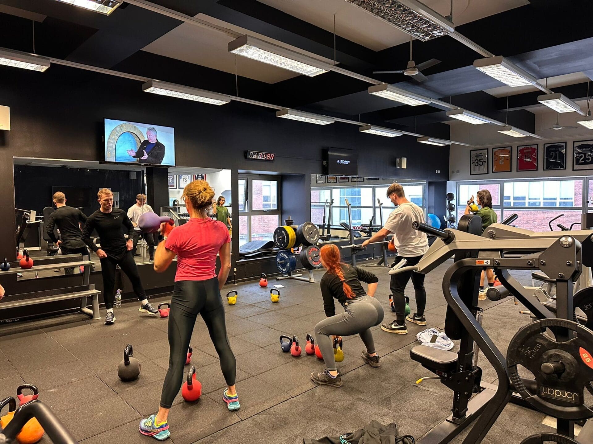 Students in getting instructed on a Level 2 Gym Instructor Course.